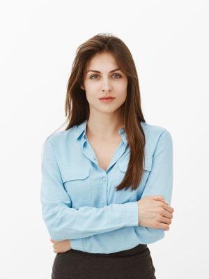 Waist-up shot of confident good-looking successful entrepreneur in blue blouse, holding hands together on chest and gazing at camera with self-assured face, listening or taking part in discussion.